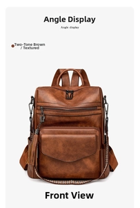 Front view of dual-tone brown backpack with textured finish, fringe and woven straps