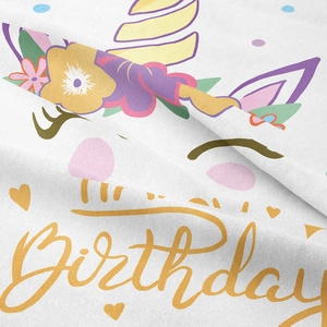 Detailed texture of bohemian unicorn birthday tapestry with floral print on white fabric