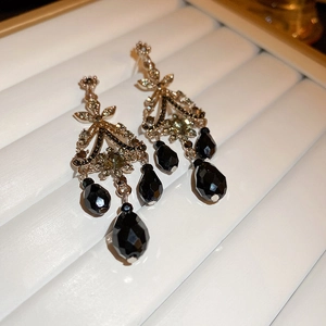 Vintage palace style chandelier earrings with black waterdrop pendants and sparkling diamonds