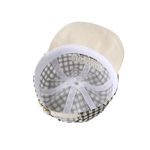 Internal detail of a plaid baby sun hat with Brooklyn embroidery and adjustable strap