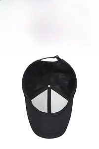 Detail of black baseball cap showing breathable mesh back and inner structural lining