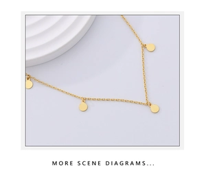 Macro view of gold S925 sterling silver chain with minimalist round disc pendants