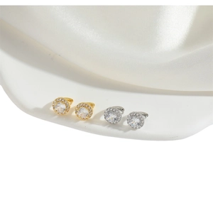 Minimalist round cubic zirconia hoop earrings shown in both gold and silver finishes