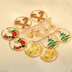Christmas earrings set featuring festive gold trees and candy canes in red and green colors