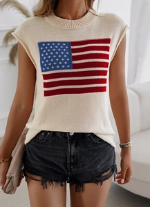 Detail of knitted sleeveless top featuring a red, white, and blue American flag pattern