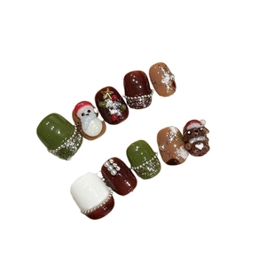 Handcrafted Christmas press-on nails set with 3D snowman and bear charms in festive colors