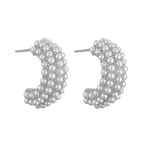 Macro detail of C-shaped drop earrings featuring multi-row inlaid white seed pearls