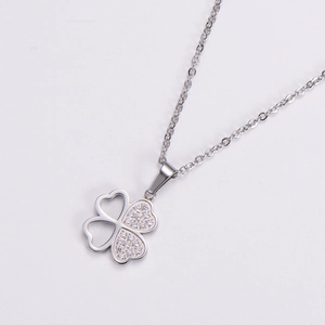 Silver four-leaf clover necklace with pave-set zircon and hollow heart-shaped leaves