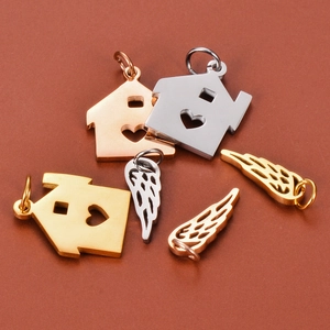 Polished stainless steel heart house and wing pendants in gold, silver, and rose gold