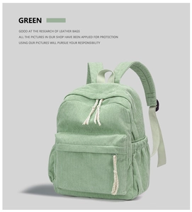 Close-up of mint green corduroy backpack showing textured knit stripes and fabric detail