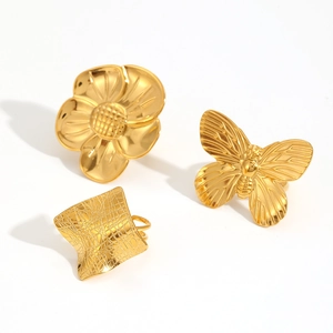 Set of three chunky 18k gold plated stainless steel rings featuring flower and butterfly motifs