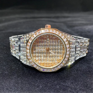 Detailed view of luxury gold and silver dual-tone watch with full square crystal settings