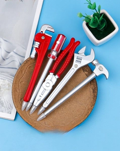 Set of five creative hardware tool ballpoint pens including hammer and wrench shapes