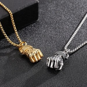Hip hop style titanium steel fist pendants in gold and silver finish for men