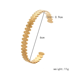 Detailed view of golden stainless steel bangle showing 0.9cm width and 6cm diameter size