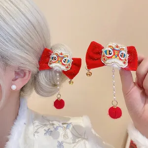 Traditional red velvet bow hair clip with embroidered lion dance head and pearl tassels