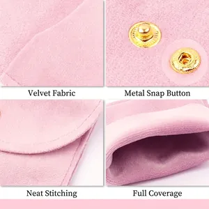 Pink velvet jewelry pouch with dual gold metal snaps and soft texture for accessory storage