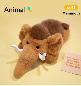 Close-up of soft mammoth plush toy with long brown fur and iconic white tusks