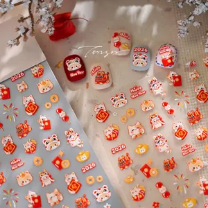 Detailed 2026 Lunar New Year nail stickers featuring 3D lucky cat and festive gold elements