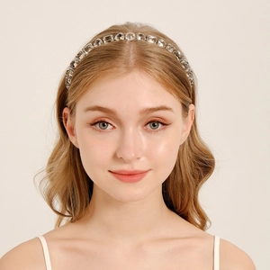 Elegant wheat-ear crystal bridal headband with sparkling rhinestones on model