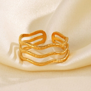 Minimalist three-layer wave open ring in gold hammered finish for a modern luxury look