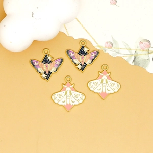 Enamel butterfly pendants in blue and pink with gold frames for jewelry making