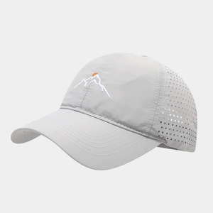 Detail of light gray mesh baseball cap showing breathable holes and mountain embroidery