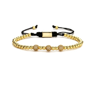 Adjustable woven bracelet featuring gold beads and micro-pave cubic zirconia accents