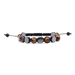 Detailed view of woven tiger eye and hematite bead bracelet with adjustable cord