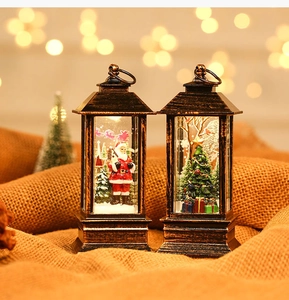 Close-up of vintage bronze Christmas lanterns with Santa and tree interior scenes