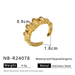 Macro detail of golden stainless steel twisted rope texture ring with dimensions