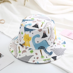 Detail of breathable cotton kids sun hat with colorful cartoon dinosaur prints and trees