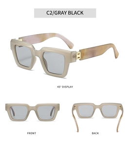 Detail view of square sunglasses with marble pattern temples and golden metal hinges