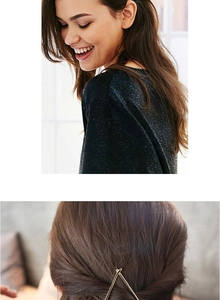 Close-up of minimalist gold triangle geometric hair clip styled on hair for women