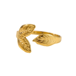 Close-up of golden leaf ring detailing polished veins and adjustable open metal band