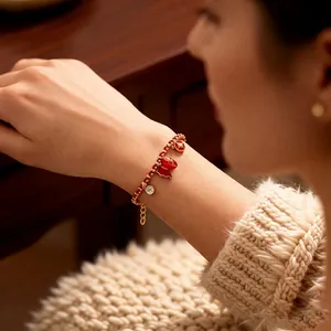 18k Gold plated red bead bracelet with lucky pouch charm and sparkling zircon stones