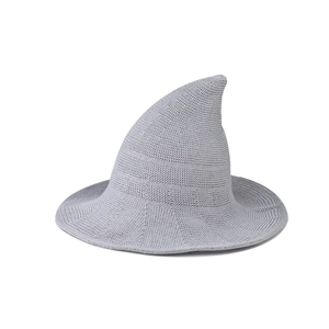 Detailed view of a light grey knitted pointed witch hat for Halloween wizard cosplay