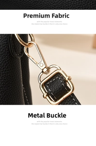 Detail of black lychee grain leather texture and round golden metal hardware on the bag