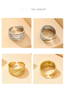 Detailed grid view of cross-line textured gold and silver stainless steel rings