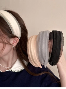 Close-up of pleated wide headband set in four elegant colors with soft chiffon texture