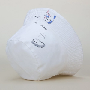 Detail of hand-drawn Power of Love cartoon print on white cotton sun bucket hat
