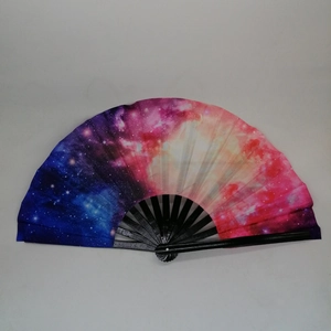 Starry galaxy pattern handheld folding fan with black ribs on a light grey background