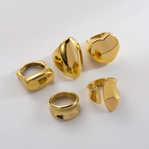 Chunky 18K gold plated heart and geometric wide rings set for women on white background