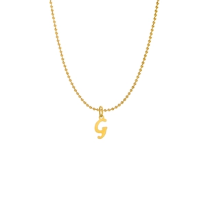Detail of a gold beaded chain necklace featuring a minimalist letter G initial pendant