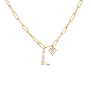 Detail of gold letter L necklace with zircon heart charm and rectangular gems on a ring chain