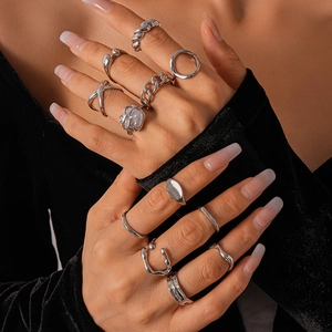 12-piece silver set of geometric irregular open rings with a polished metallic finish