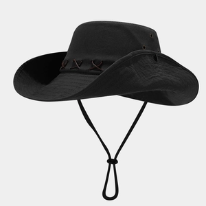 Detailed macro view of the western cowboy hat with metal eyelets and leather stitching