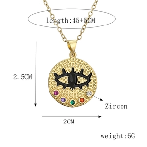 Gold evil eye necklace with colorful zircon inlay on circular textured pendant