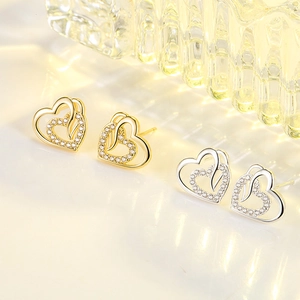 Elegant heart-shaped stud earrings with sparkling cubic zirconia in gold and silver