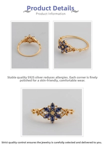 Macro detail of S925 sterling silver ring with blue marquise stones and floral design